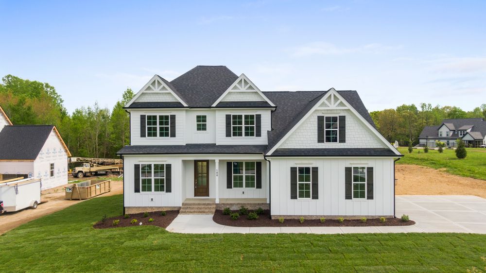 White craftsman house exterior with black shutters