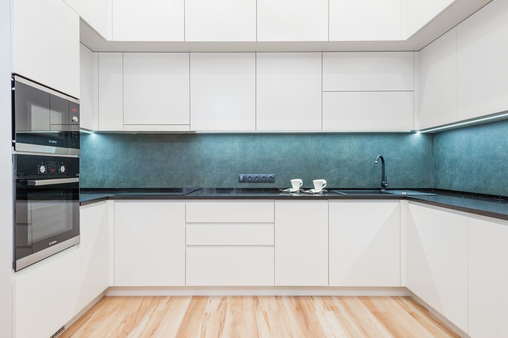Bright modern kitchen with freshly painted white cabinets